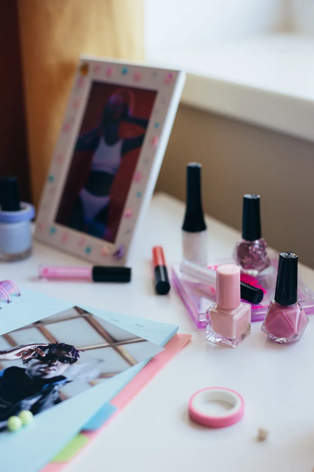 Pink nail polish bottles on a table