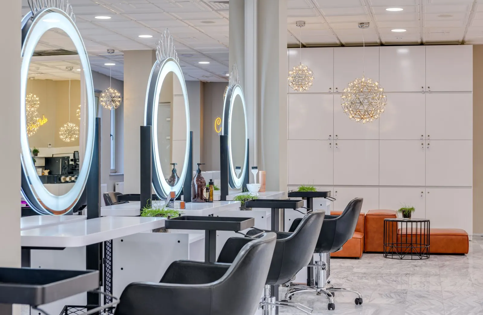 Salon stations with round illuminated mirrors